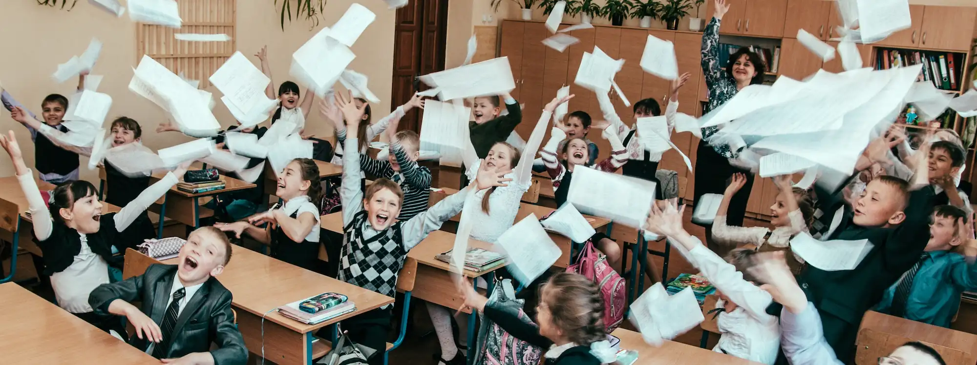 kids throwing papers