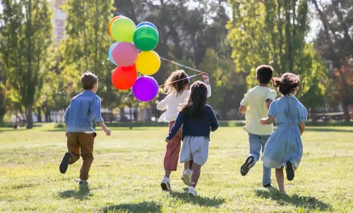 kids running with balloons